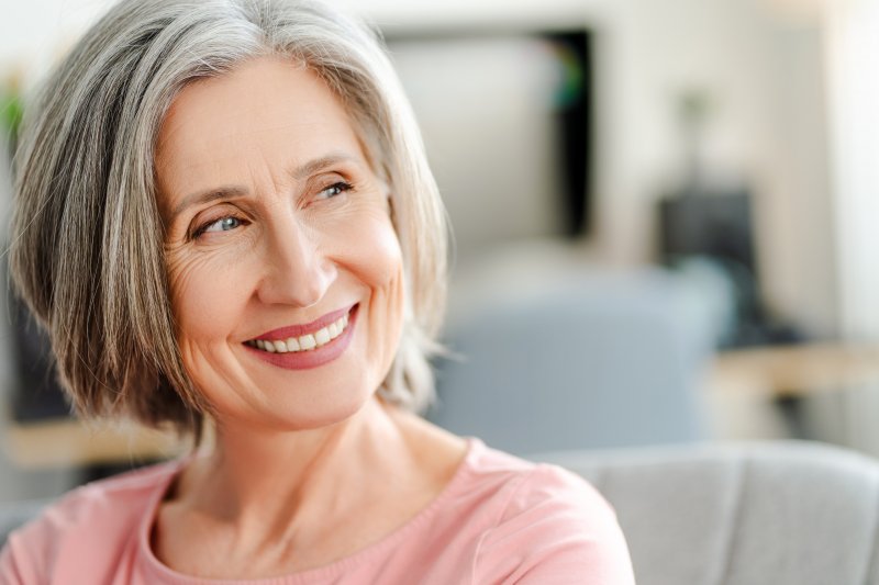 an older woman showing off her smile